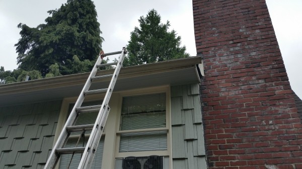Ladder to install a gutter
